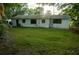 Exterior view of home with green lawn at 637 Jamaica Ave, Tampa, FL 33606