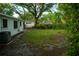 View of backyard with partial brick paver path and grass at 637 Jamaica Ave, Tampa, FL 33606