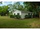 Classic home with a green lawn, and mature shrubs at 637 Jamaica Ave, Tampa, FL 33606