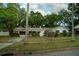 Charming single-story home with well-maintained lawn and mature trees in a desirable neighborhood at 637 Jamaica Ave, Tampa, FL 33606
