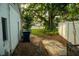 Side yard view of home with garbage containers at 637 Jamaica Ave, Tampa, FL 33606