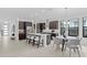 Modern kitchen with island, breakfast nook, and stainless steel appliances at 741 58Th Ne Ave, St Petersburg, FL 33703