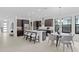 Modern kitchen with stainless steel appliances, large island, and breakfast nook, creating a modern design at 741 58Th Ne Ave, St Petersburg, FL 33703