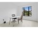Simple office space with a desk and chair near a large window at 741 58Th Ne Ave, St Petersburg, FL 33703