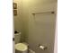 Simple half bathroom with a toilet and a towel rack at 10058 Corso Milano Dr, Tampa, FL 33625