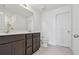 This primary bathroom features a double vanity, tile floors, and a walk-in shower at 10533 Hidden Banks Gln, Parrish, FL 34219