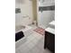 Well-lit bathroom showcasing a bathtub, shower, and modern vessel sink at 1182 Norwood Ave, Clearwater, FL 33756