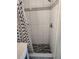 Updated shower featuring contemporary fixtures and patterned tiles at 1182 Norwood Ave, Clearwater, FL 33756