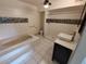 Bathroom with updated vanity, tiled floor, tub/shower and modern fixtures at 1182 Norwood Ave, Clearwater, FL 33756