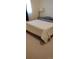Comfortable bedroom with plush carpeting, a queen-sized bed, and soft natural light at 1182 Norwood Ave, Clearwater, FL 33756