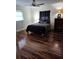Cozy bedroom with sleek wood floors and a comfortable bed, ideal for relaxation at 1182 Norwood Ave, Clearwater, FL 33756