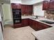 Updated kitchen, granite counters, dark wood cabinets at 1182 Norwood Ave, Clearwater, FL 33756