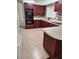 Spacious kitchen with modern appliances and dark wood cabinetry at 1182 Norwood Ave, Clearwater, FL 33756