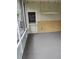 Enclosed screened in porch with a door leading outside at 1182 Norwood Ave, Clearwater, FL 33756