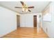 Bedroom with light wood floors, closet, and natural lighting is inviting at 11945 Carmen Ave, Dade City, FL 33525