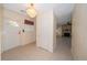 The foyer features a door with decorative glass and a view into the living room at 11945 Carmen Ave, Dade City, FL 33525