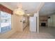 View of the eat-in kitchen area, featuring white cabinets and a large window at 11945 Carmen Ave, Dade City, FL 33525
