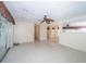 Open living area with tile flooring, sliders, and access to the kitchen and dining areas at 11945 Carmen Ave, Dade City, FL 33525