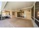 Covered patio with a fan provides a relaxing outdoor space with access to a pool at 11945 Carmen Ave, Dade City, FL 33525