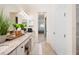 Double vanity bathroom with view into bedroom at 12241 Perennial Pl, Bradenton, FL 34211