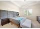 Main bedroom with a plush bed and sitting area at 12241 Perennial Pl, Bradenton, FL 34211