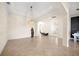 Spacious dining room with tile floors, a large chandelier, and views into the living room and kitchen at 12241 Perennial Pl, Bradenton, FL 34211