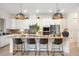 Island kitchen with granite countertops and stainless steel appliances at 12241 Perennial Pl, Bradenton, FL 34211