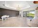 Bright living room with large windows and access to backyard at 12241 Perennial Pl, Bradenton, FL 34211