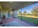 Relaxing screened patio overlooking a lush green backyard at 12241 Perennial Pl, Bradenton, FL 34211