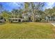 Ranch home with spacious yard and trees at 15040 Lake Magdalene Blvd, Tampa, FL 33618