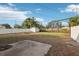 Large back yard featuring a privacy fence, lawn, and patio at 1593 76Th N Ave, St Petersburg, FL 33702