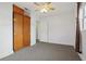 Bedroom with ceiling fan, carpet flooring, and built-in closet at 1593 76Th N Ave, St Petersburg, FL 33702