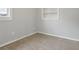 Bedroom corner with wood-look tile floor and built-in shelving at 1593 76Th N Ave, St Petersburg, FL 33702
