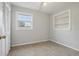 Bright bedroom with window, built-in shelving and wood-look tile floor at 1593 76Th N Ave, St Petersburg, FL 33702