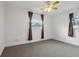 Bright bedroom with ceiling fan and large windows at 1593 76Th N Ave, St Petersburg, FL 33702