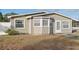Tan house with white fence and small front yard at 1593 76Th N Ave, St Petersburg, FL 33702
