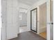 Hallway with mirror, carpet, and views of the bedrooms and bathroom at 1593 76Th N Ave, St Petersburg, FL 33702