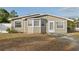 Tan house with bay window and driveway at 1593 76Th N Ave, St Petersburg, FL 33702