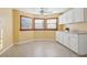 Bright eat-in kitchen with white cabinets and tile floor at 1593 76Th N Ave, St Petersburg, FL 33702