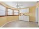 Small kitchen with white cabinets and tile floor at 1593 76Th N Ave, St Petersburg, FL 33702