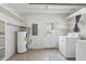 Laundry room with washer, dryer, shelving and exterior access at 1593 76Th N Ave, St Petersburg, FL 33702