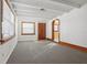 Living room with gray carpet and wood trim at 1593 76Th N Ave, St Petersburg, FL 33702