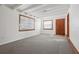 Spacious living room with gray carpet and exposed beams at 1593 76Th N Ave, St Petersburg, FL 33702