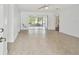 Bright living room with tile floors and sliding doors at 17255 2Nd E St, North Redington Beach, FL 33708