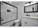 Bathroom with subway tile, frameless shower, and modern vanity at 2292 Austrian Ln # 34, Clearwater, FL 33763