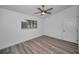 Bright bedroom with ceiling fan and grey vinyl flooring at 2292 Austrian Ln # 34, Clearwater, FL 33763