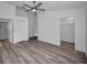 Spacious bedroom with ceiling fan, large closet, and grey vinyl flooring at 2292 Austrian Ln # 34, Clearwater, FL 33763