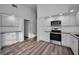 Bright kitchen with white cabinets, granite countertops and stainless steel appliances at 2292 Austrian Ln # 34, Clearwater, FL 33763