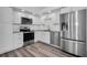 Modern kitchen with stainless steel appliances and white cabinets at 2292 Austrian Ln # 34, Clearwater, FL 33763