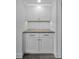 White shaker cabinets and granite countertop in a small kitchen at 2292 Austrian Ln # 34, Clearwater, FL 33763